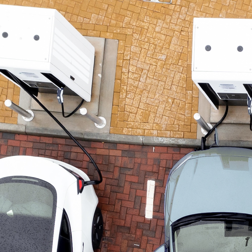 Evailable Solutions - CPO - Charging stations are important, shown here in a car park situation with charging electric vehicles.